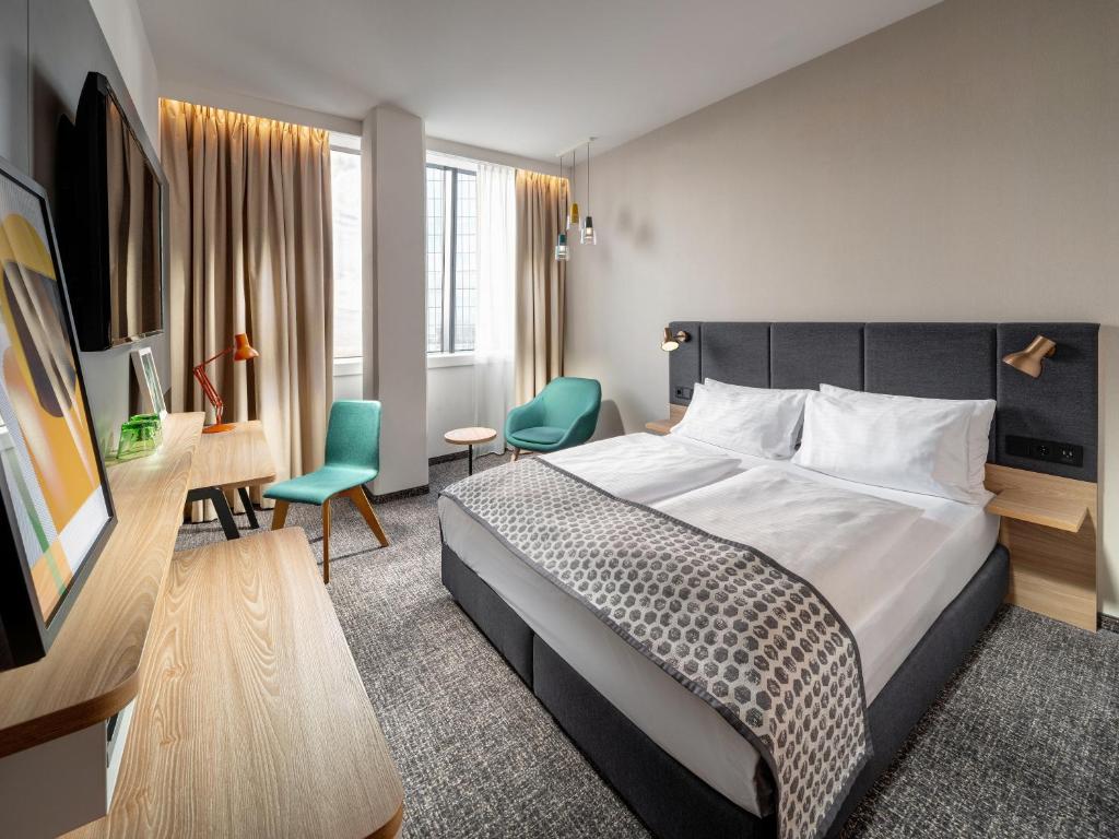 Postel nebo postele na pokoji v ubytování Clarion Hotel Vienna South