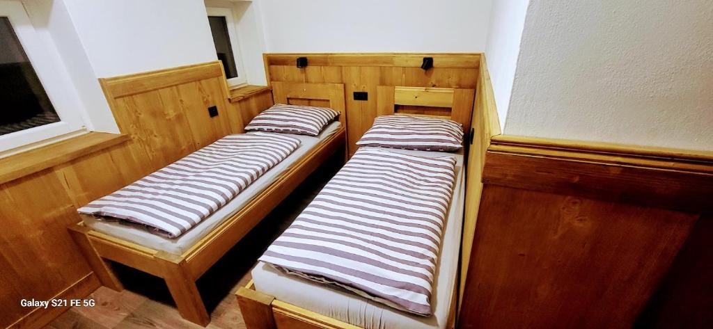 Postel nebo postele na pokoji v ubytování Bouda Na Pláni - horská bouda