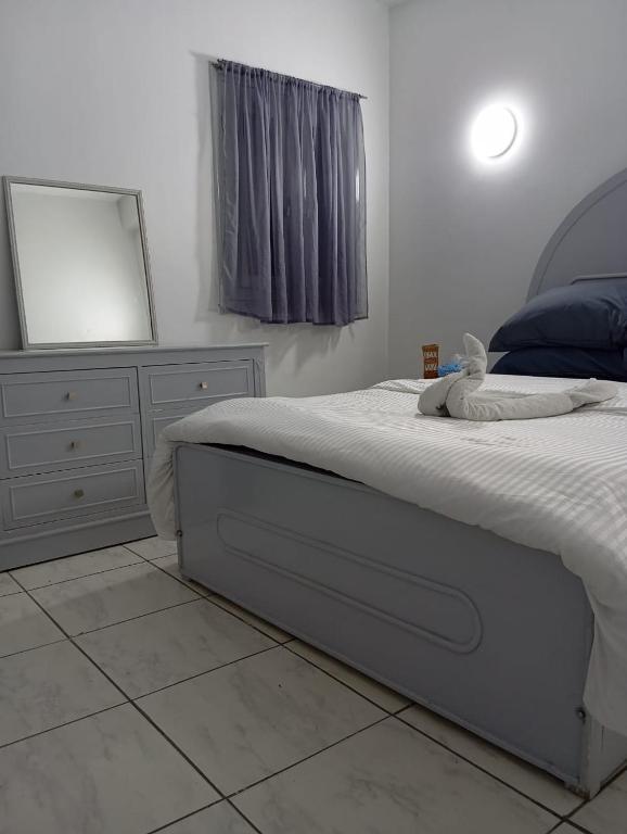 Postel nebo postele na pokoji v ubytování Abeer Guest House