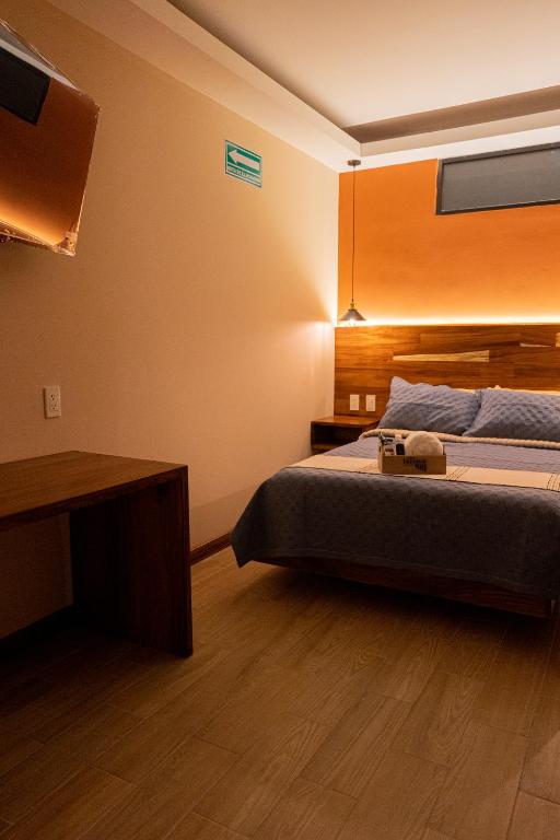 Postel nebo postele na pokoji v ubytování Casa Tsumbak