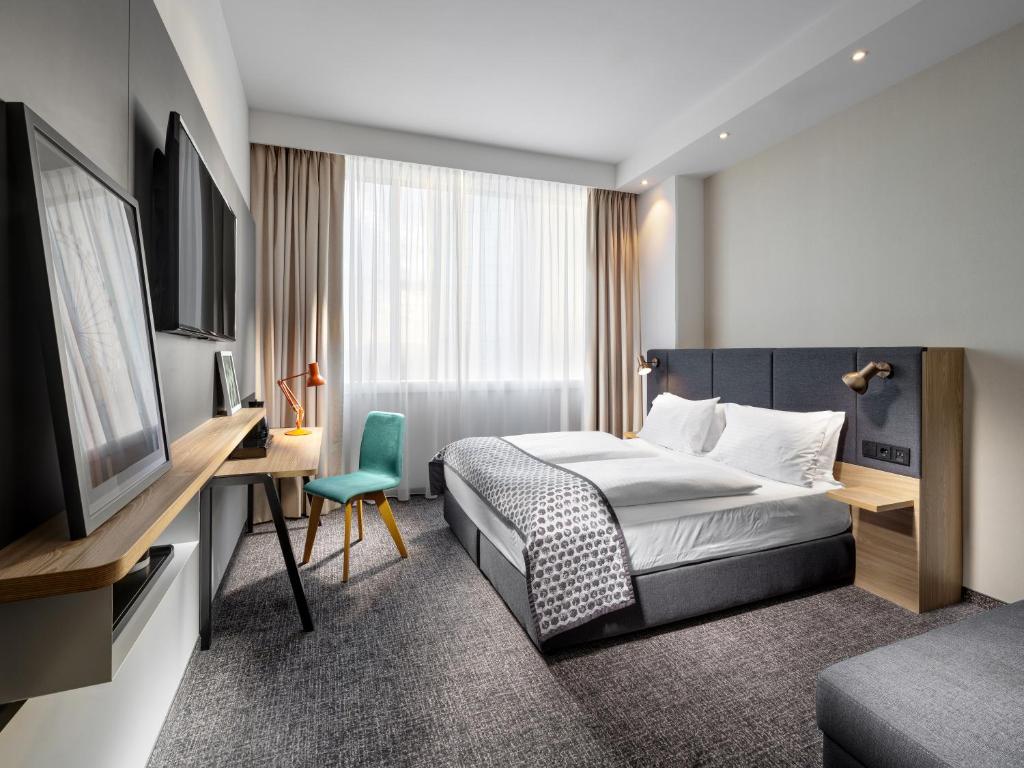 Postel nebo postele na pokoji v ubytování Clarion Hotel Vienna South