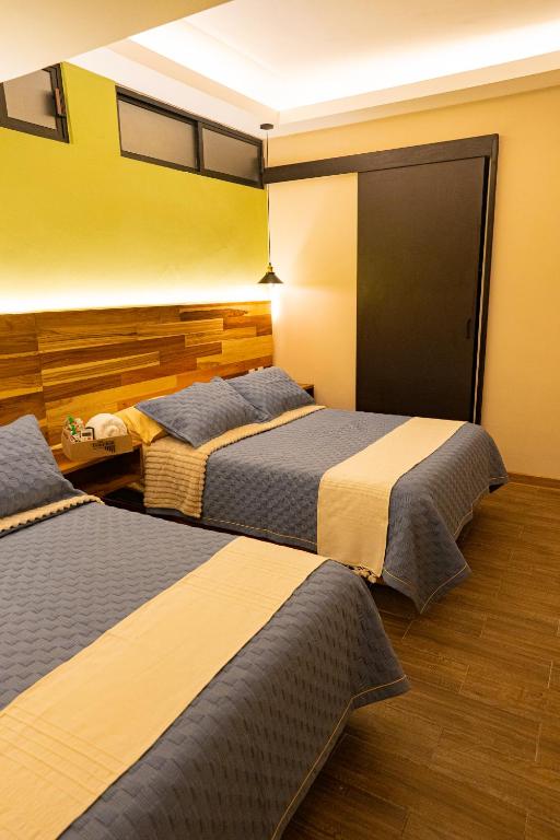 Postel nebo postele na pokoji v ubytování Casa Tsumbak