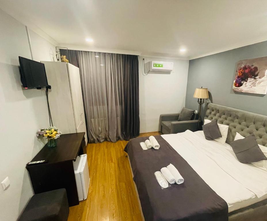 Postel nebo postele na pokoji v ubytování Hotel Art Green