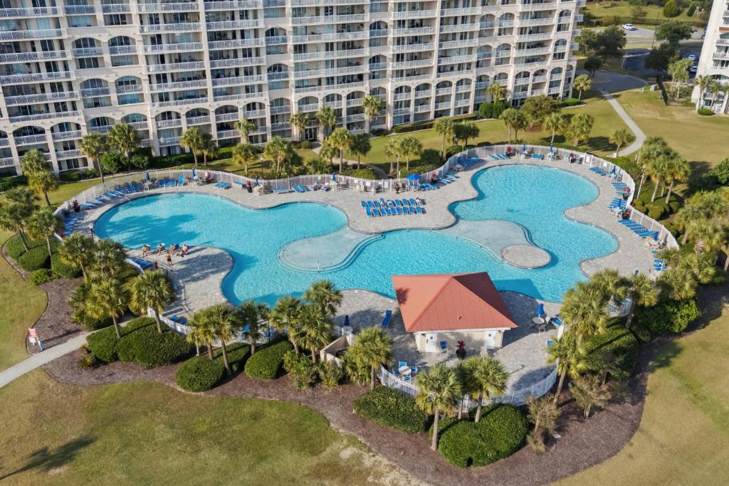 an aerial view of a pool at a resort at Yacht Club Villas 1-505 - Marina View in Myrtle Beach