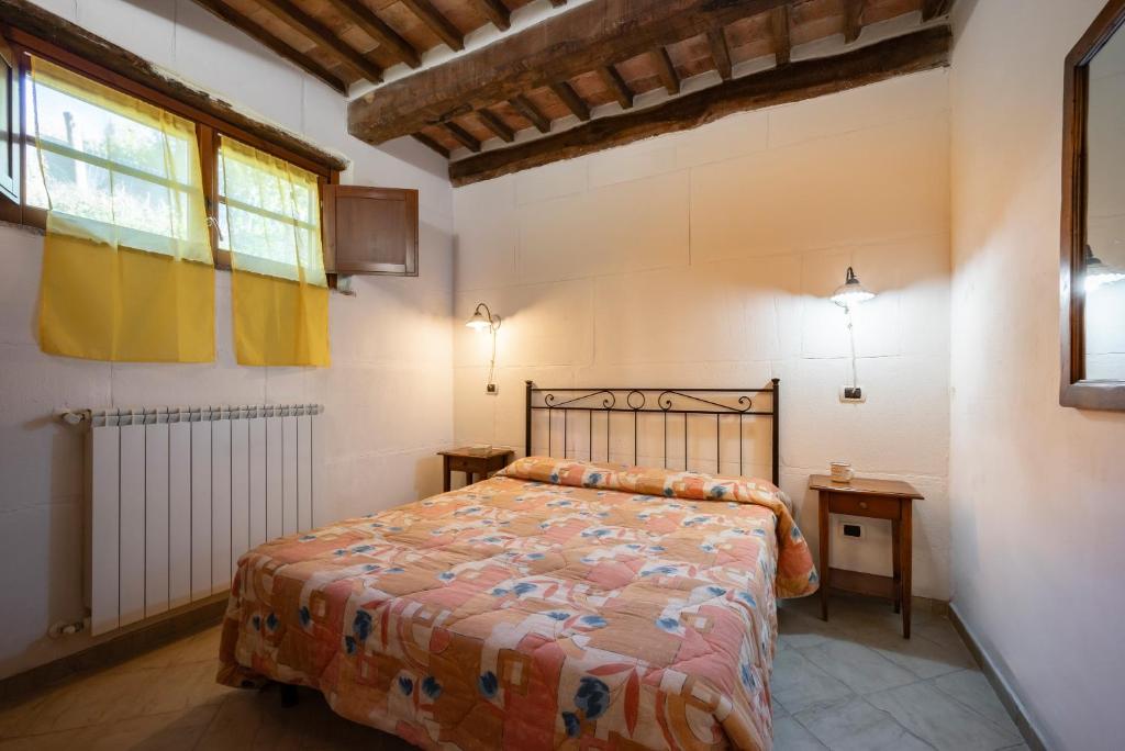 Postel nebo postele na pokoji v ubytování Relais Il Ciliegio