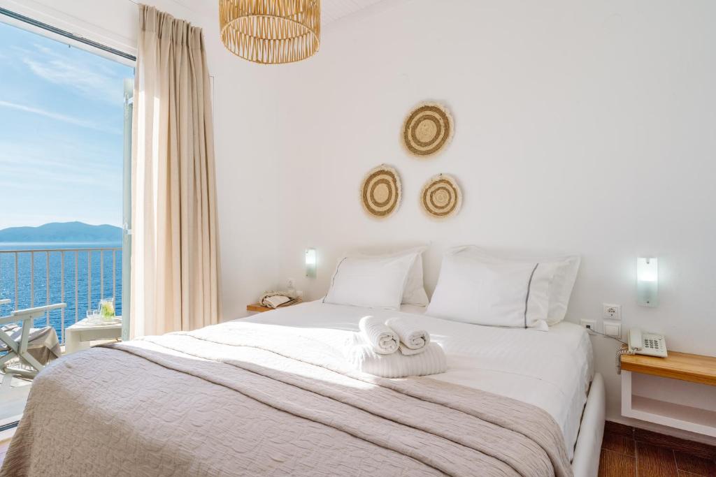 Postel nebo postele na pokoji v ubytování Kanakis Apartments