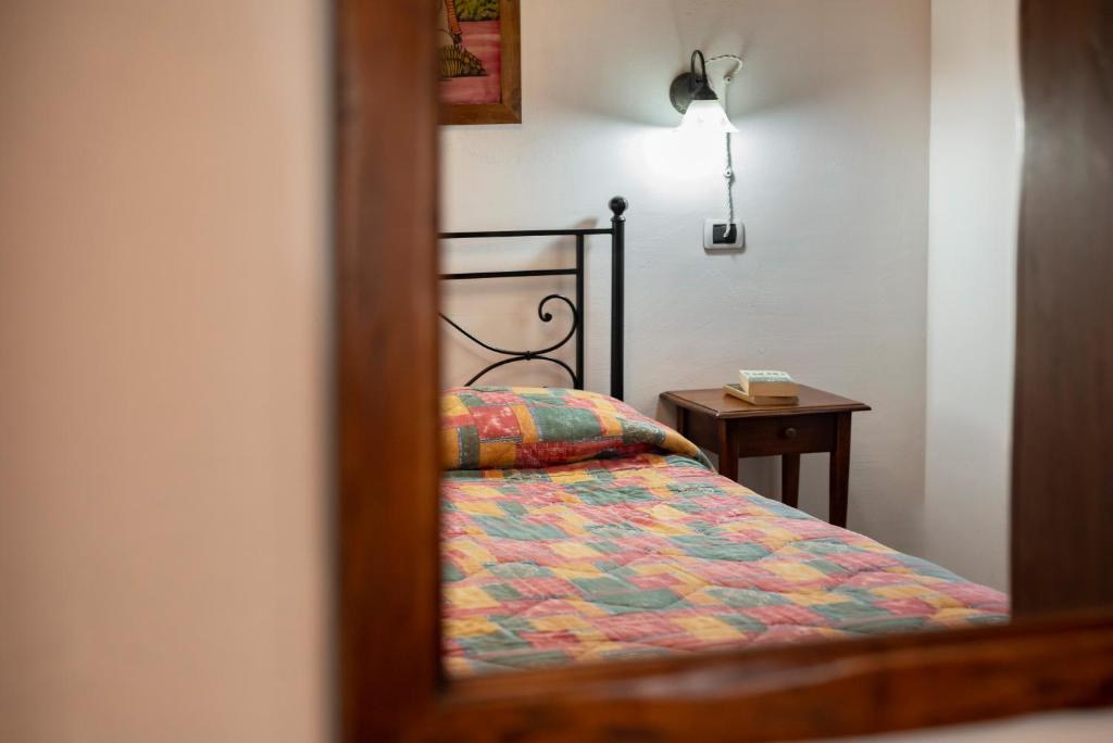 Postel nebo postele na pokoji v ubytování Relais Il Ciliegio