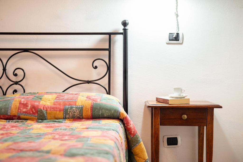 Postel nebo postele na pokoji v ubytování Relais Il Ciliegio