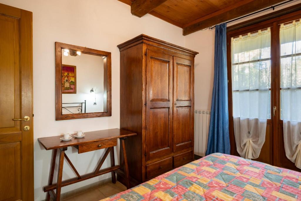 Postel nebo postele na pokoji v ubytování Relais Il Ciliegio