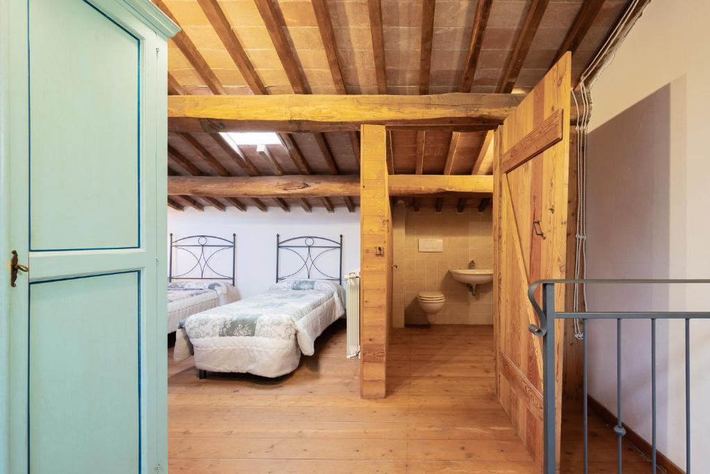 Postel nebo postele na pokoji v ubytování Relais Il Ciliegio