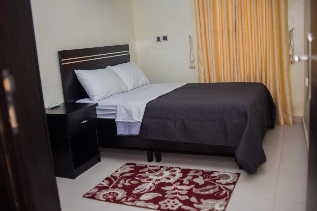 Postel nebo postele na pokoji v ubytování 4 Bedroom all ensuite "Milk & Honey" Home in Adeniyi Jones Ikeja