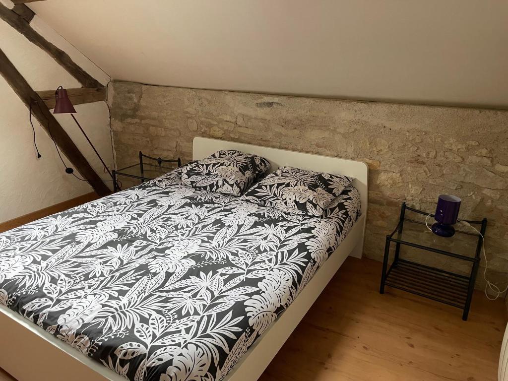 Postel nebo postele na pokoji v ubytování Dijon et alentours