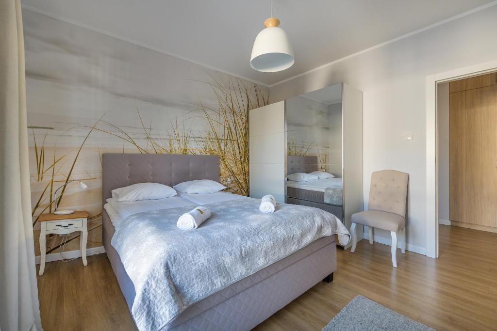 Posteľ alebo postele v izbe v ubytovaní Amber Baltic Apartment
