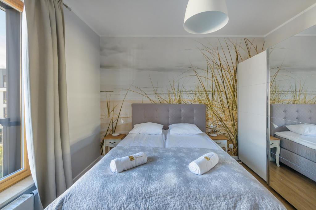 Posteľ alebo postele v izbe v ubytovaní Amber Baltic Apartment