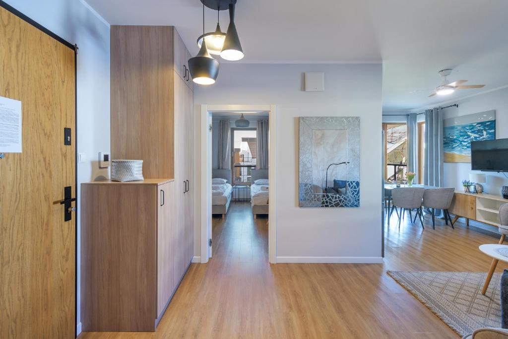 Televízia a/alebo spoločenská miestnosť v ubytovaní Amber Baltic Apartment