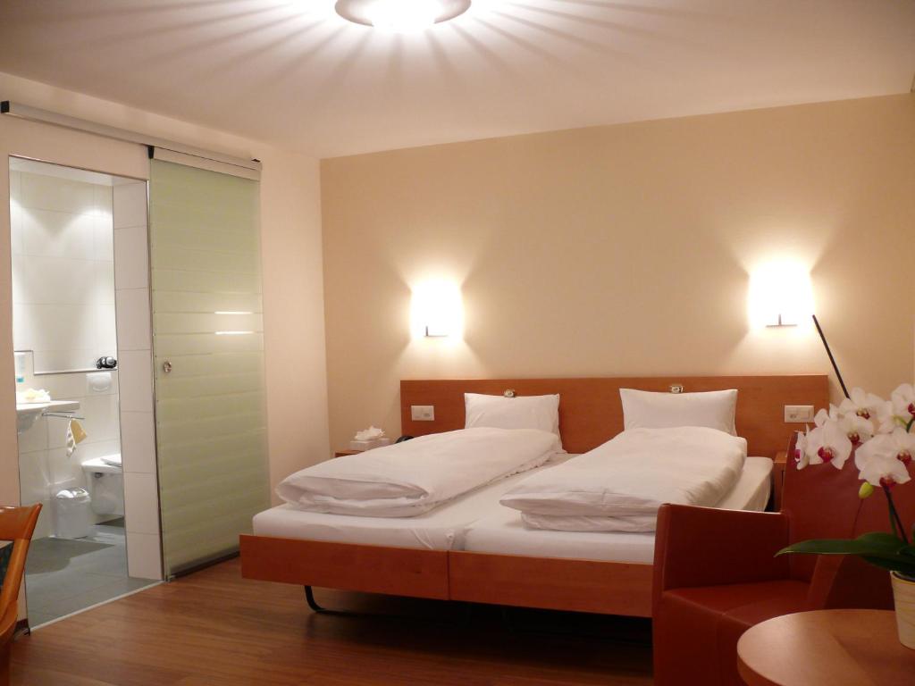 Postel nebo postele na pokoji v ubytování Hotel Restaurant Eichberg
