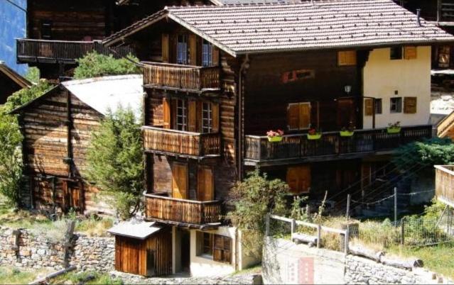 an old house with balconies on the side of it at Chalet Bel Horizon in Saint-Martin