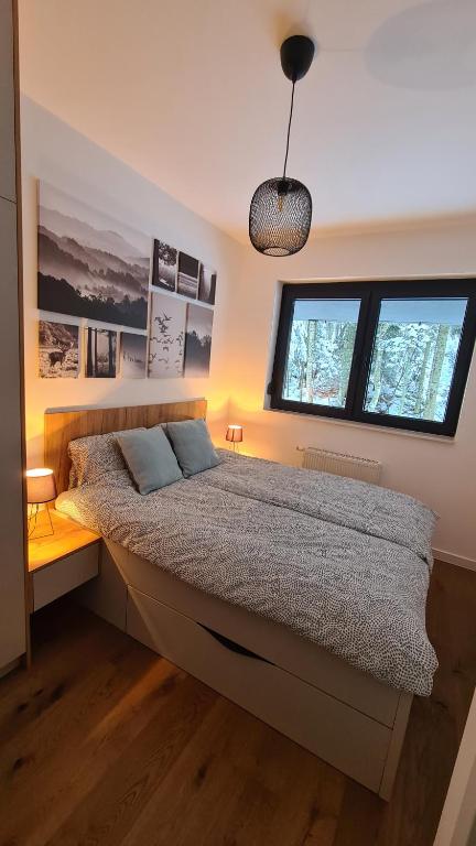 Ένα ή περισσότερα κρεβάτια σε δωμάτιο στο Apartman Dani