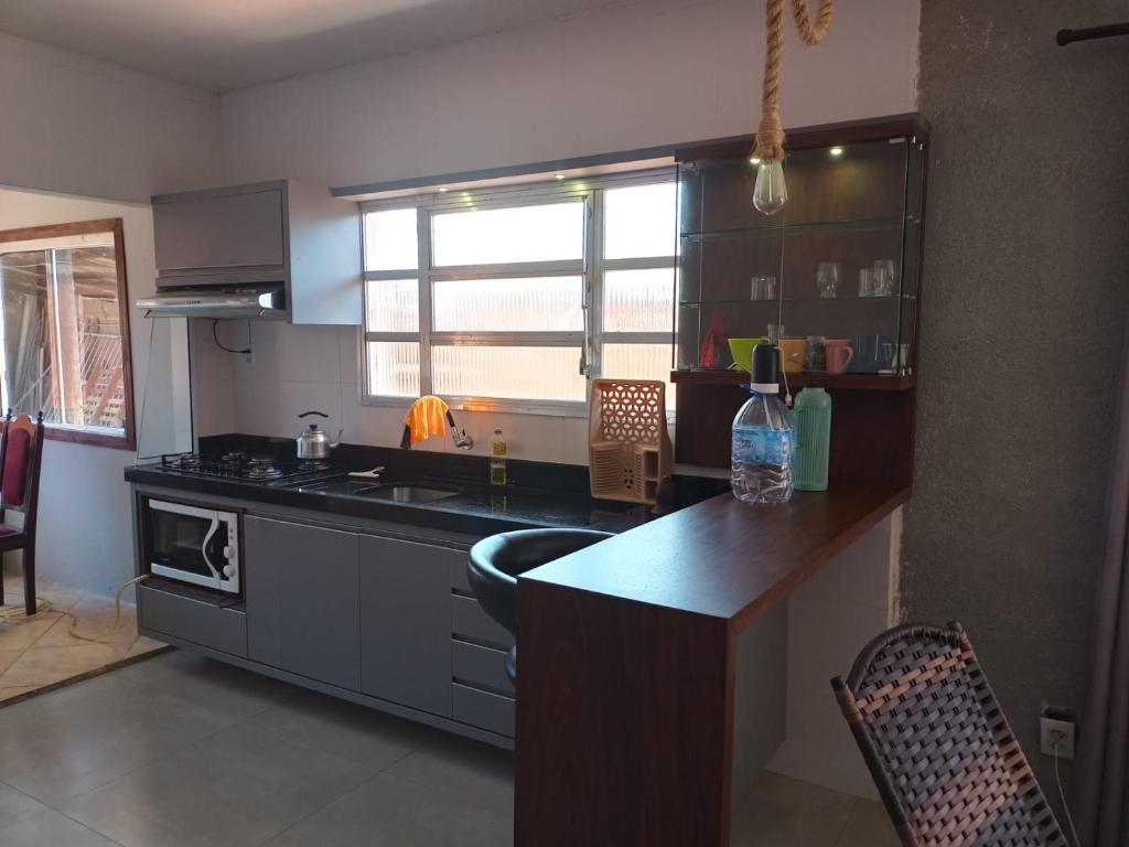 Nhà bếp/bếp nhỏ tại Lar doce lar