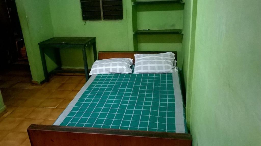 A bed or beds in a room at Xavier Guest House