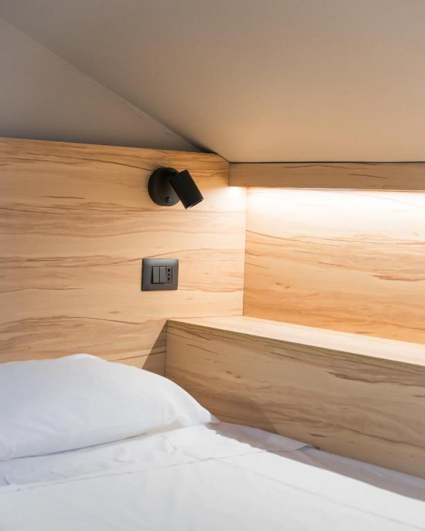 A bed or beds in a room at Hotel Chery