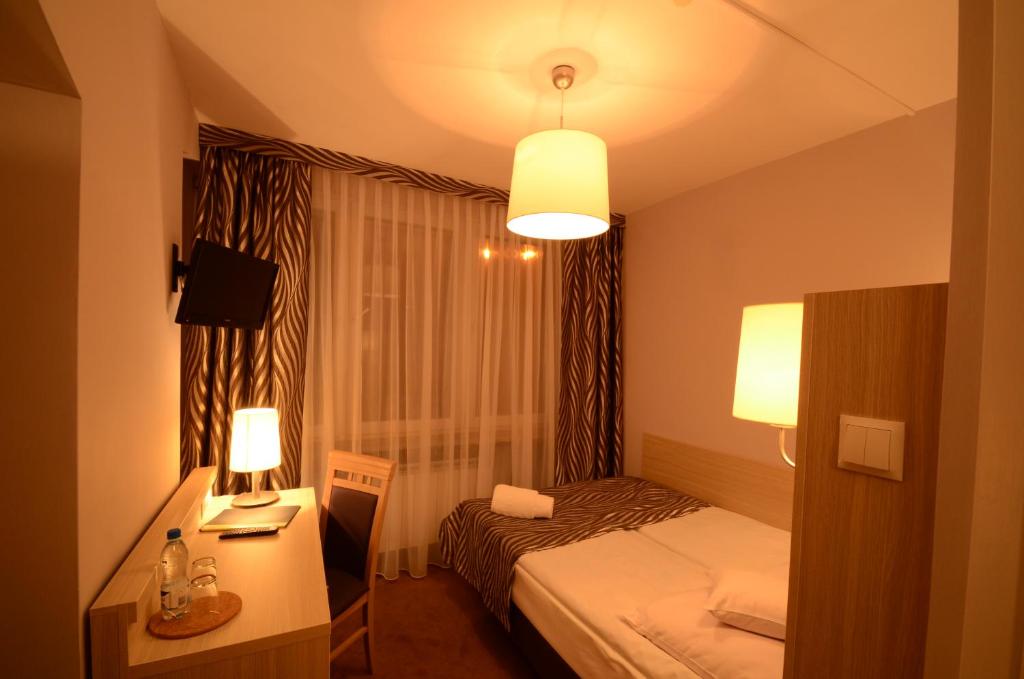 Posteľ alebo postele v izbe v ubytovaní Hotel PZMot