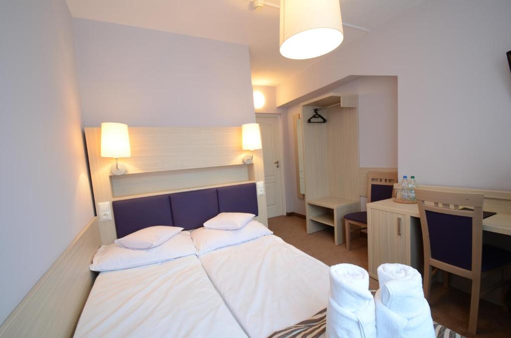 Posteľ alebo postele v izbe v ubytovaní Hotel PZMot