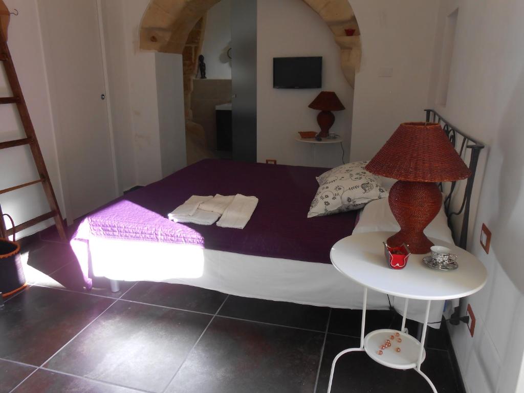 Postel nebo postele na pokoji v ubytování Matera's B&B