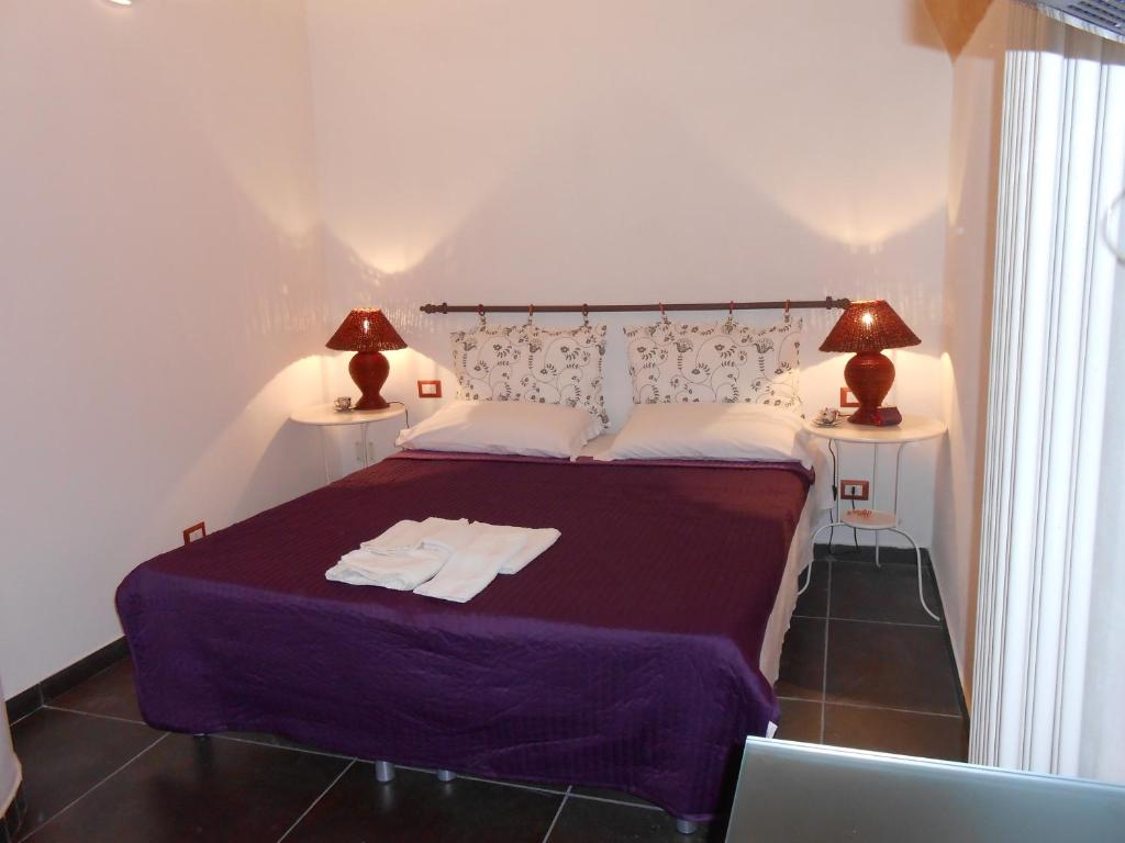 Postel nebo postele na pokoji v ubytování Matera's B&B