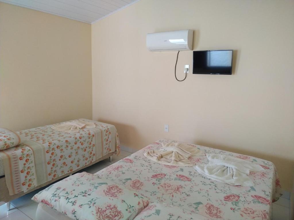 Postel nebo postele na pokoji v ubytování Pousada Lua Mar Arraial d'Ajuda