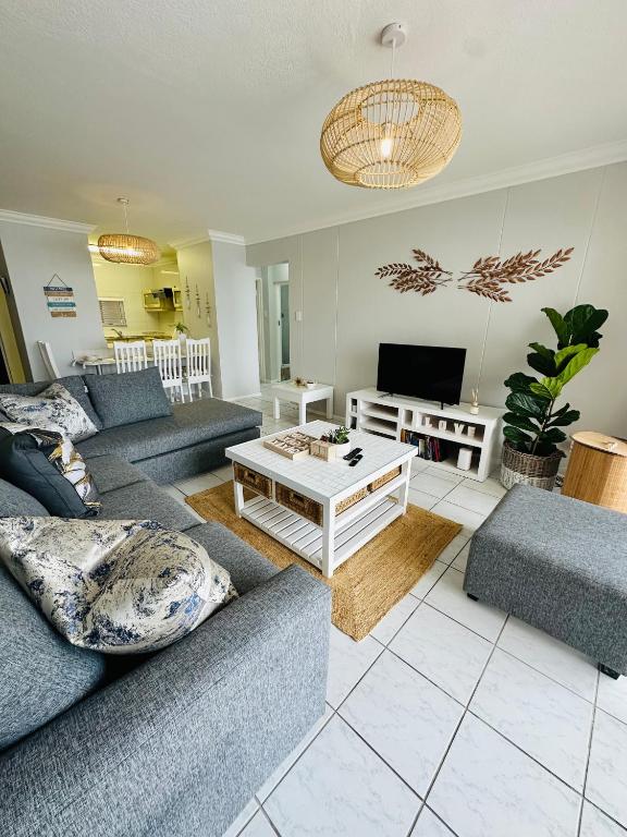 a living room with two couches and a tv at 13 Chesapeake Bay in Margate