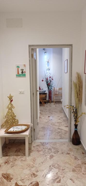 a hallway with a christmas tree in a room at CasaRA in Bari