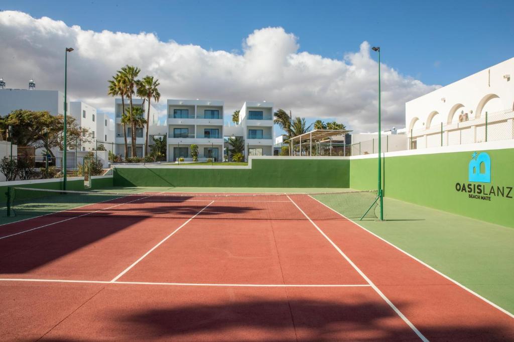 a tennis court in front of a building at Oasis Lanz Beach Mate in Costa Teguise