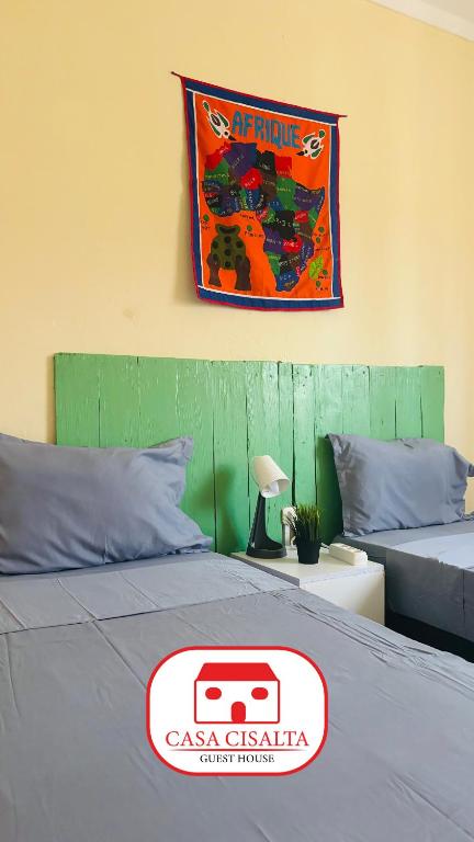 Postel nebo postele na pokoji v ubytování Casa Cisalta N4 - Quarto Compartilhado