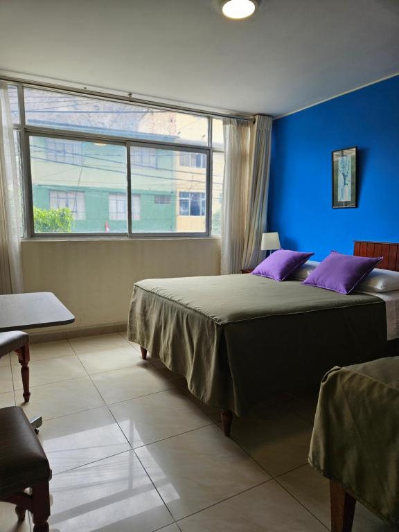 Postel nebo postele na pokoji v ubytování Hotel Acuario