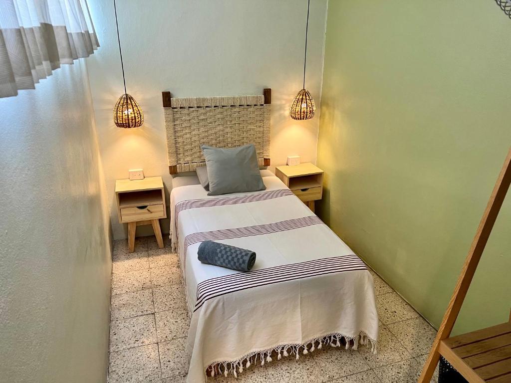 Letto o letti in una camera di Hostal Central Oaxaca