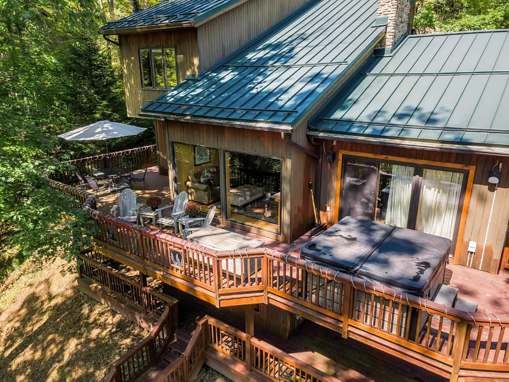 an aerial view of a house with a deck at Spacious Chalet Hot Tub Sauna Holiday Valley in Ellicottville