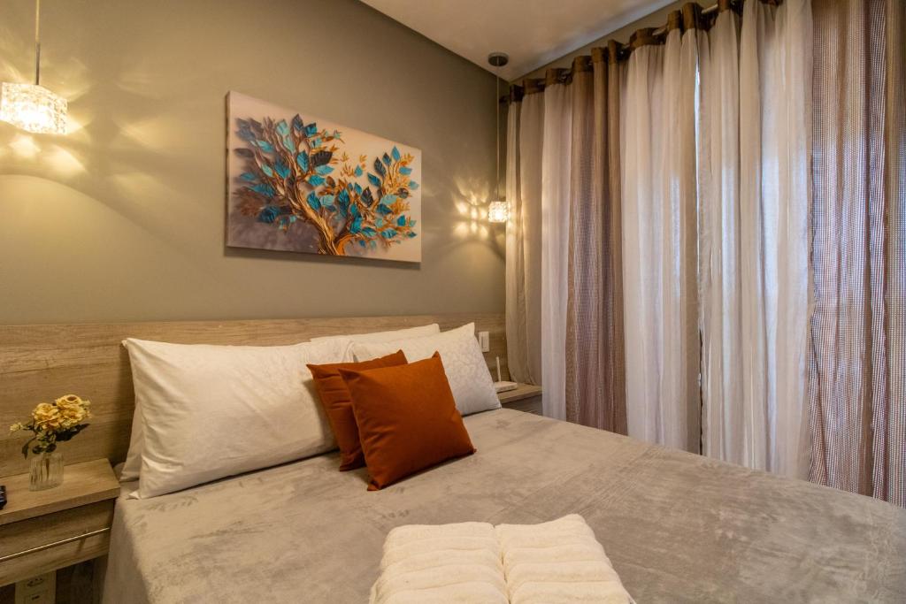 Postel nebo postele na pokoji v ubytování Uptown Apartament - GRU 2202