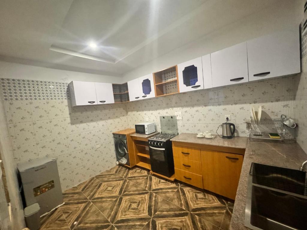 Kuchyň nebo kuchyňský kout v ubytování PrimeAxis Hub Apartment