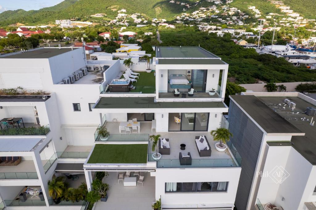 an aerial view of a white building at Very luxury Waterfront apartment at Las Brisas in Koolbaai