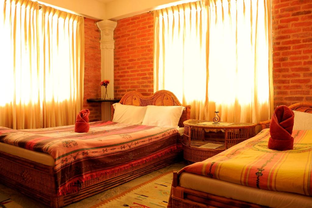 Letto o letti in una camera di Peace Eye Guest House