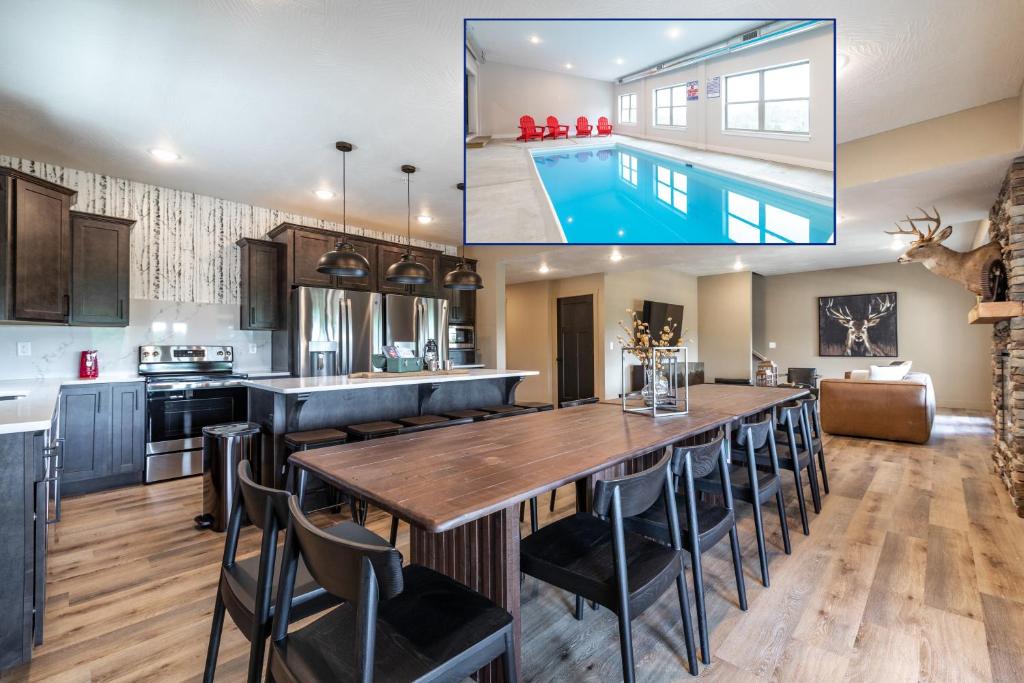 a kitchen and dining room with a large table and a pool at Branson 10 Bedroom Lakeside Lodge! PRIVATE HEATED POOL! in Hollister