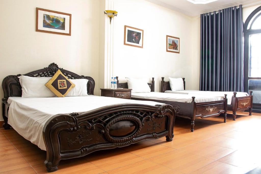 Postel nebo postele na pokoji v ubytování HomeTown Cha Hotel