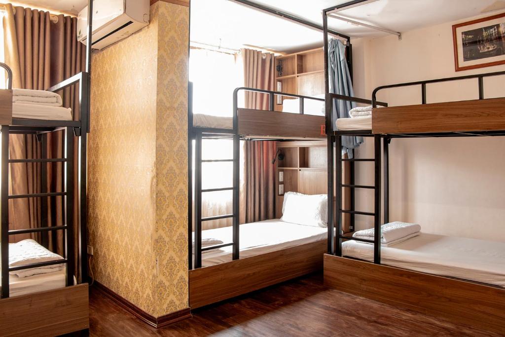 Postel nebo postele na pokoji v ubytování HomeTown Cha Hotel