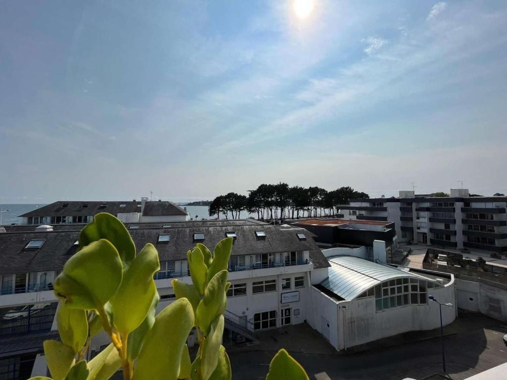 a view of a building in a city with buildings at Appartement Bénodet 4 pers, proche plage - FR-1-481-169 in Bénodet
