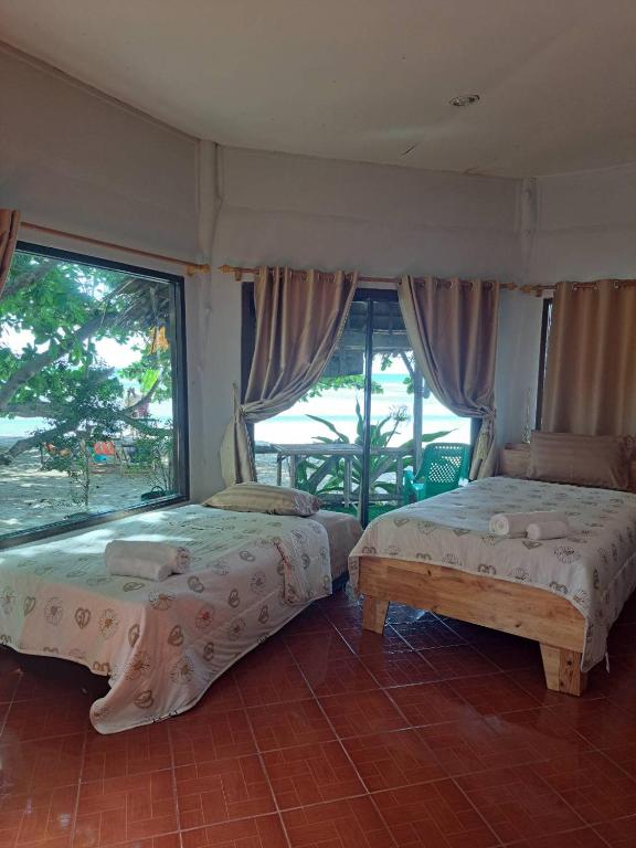 Postel nebo postele na pokoji v ubytování YAKAH BUNGALOWS By WILAI