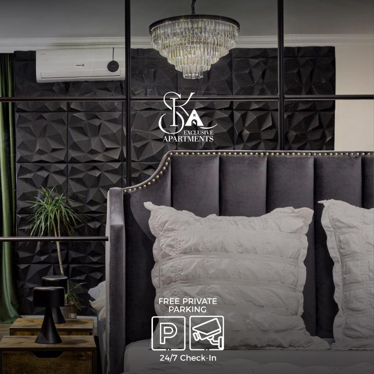 a bed with white pillows and a sign that says free furniture rendering at Sika Onyx Garden Apartment - cazare Arad - self check-in in Arad