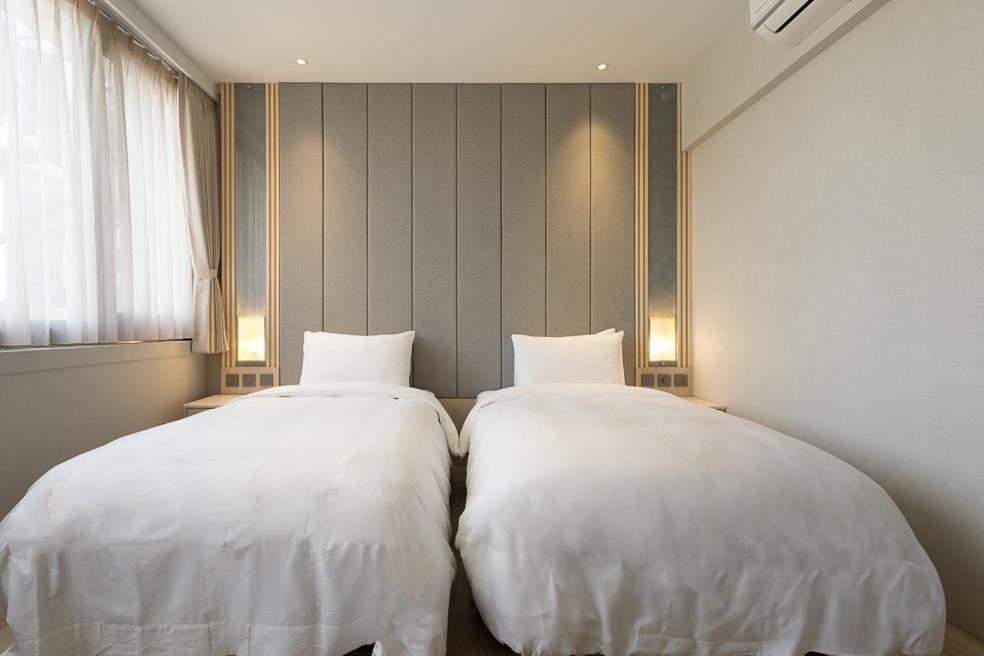 Postel nebo postele na pokoji v ubytování Gamalan Breeze Hotel