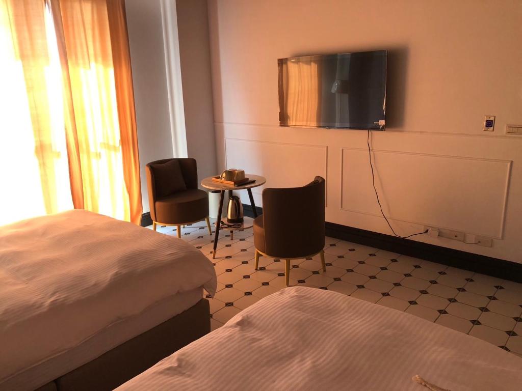 Postel nebo postele na pokoji v ubytování Stroll at Wudao Inn