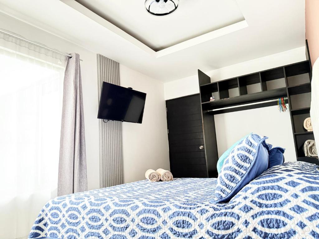 Postel nebo postele na pokoji v ubytování Casa Matiza, 7 min SJO airport, free parking, AC